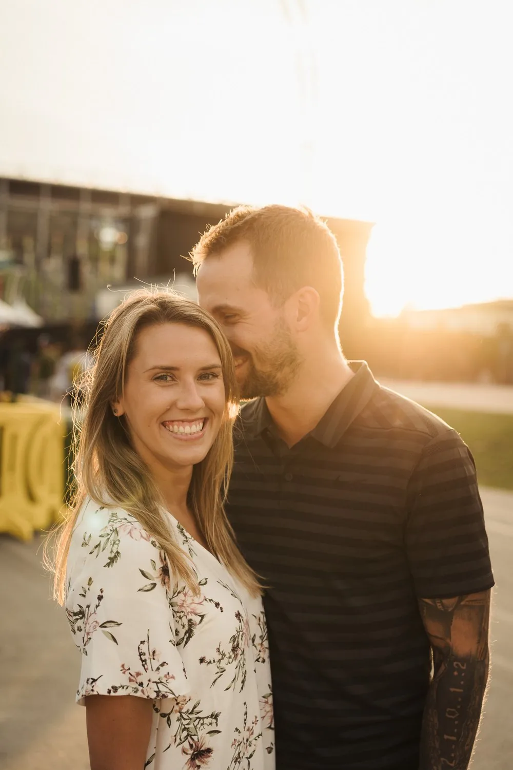 Golden hour engagement portrait of a smiling couple